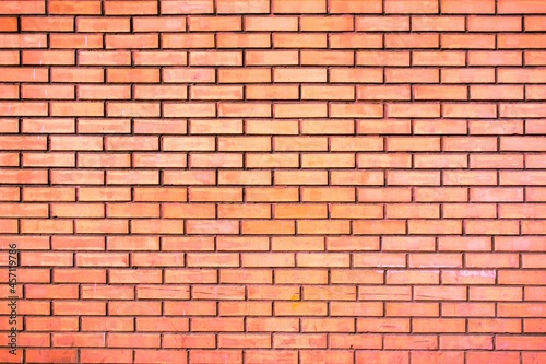 Weathered stained old orange brick wall background