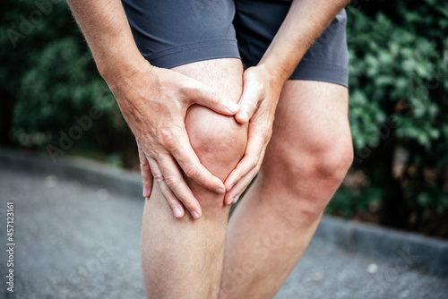 Meniscus tear in man athlete's knee, sports injuries concept photo