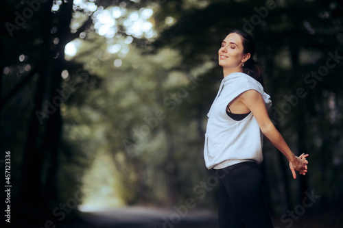 Sporty Woman Stretching Her Arms Before Jogging 