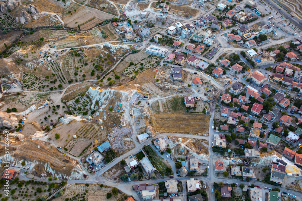 Fototapeta premium Cappadocia, Turkey - September 1, 2021 - Cappadocia Panoramic - Hot air balloon flying in early morning over rock landscape at Cappadocia Turkey
