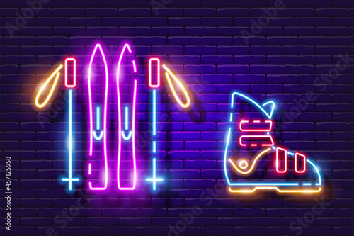 Skiing set neon icon. Skis, ski poles and boots glowing sign. Vector illustration for design. Sports concept.