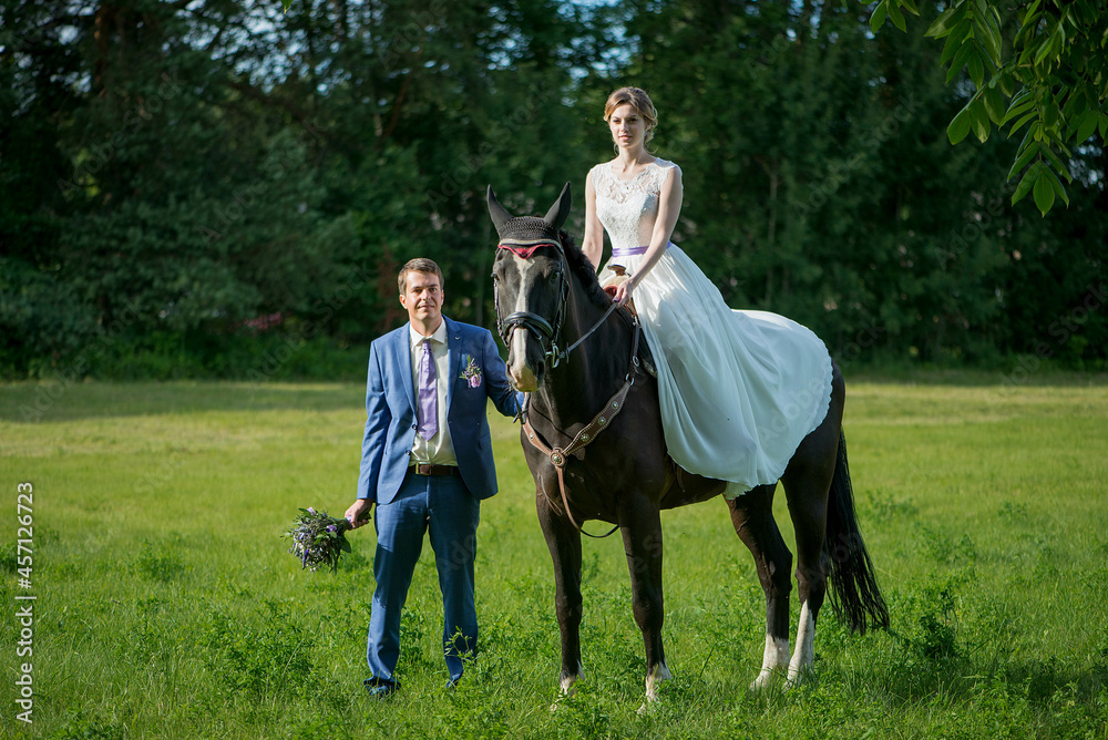 Happy woman bride is ridding the horse Happy woman bride is ridding the horse
