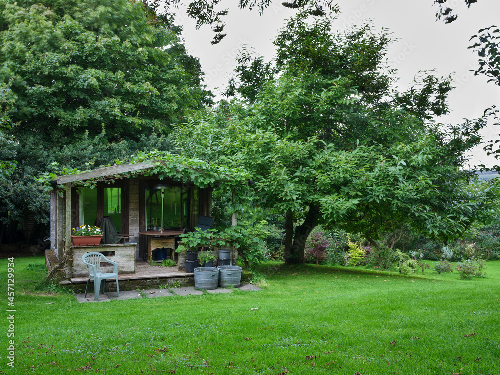 September and vine covered summer house cleared as autumn begins to show