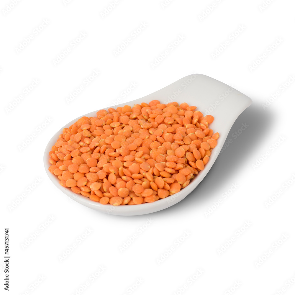 White Dish spoon full of red lentils White Dish spoon full of red lentils