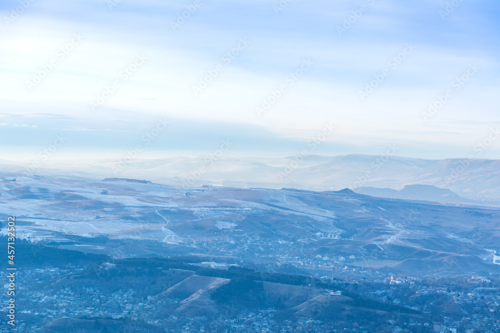 Kislovodsk, Russia. December 28, 2018. Evening view from a high mountain to the mountains and forest of Kislovodsk.