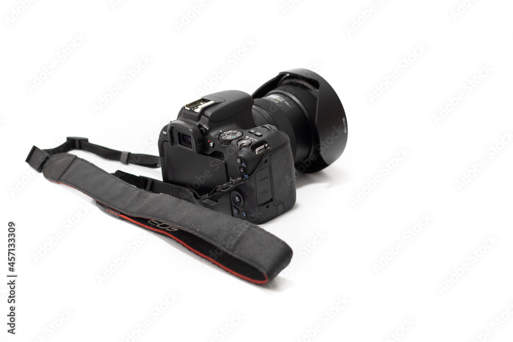 a photo camera with lens, on a white background. Copy space, selective focus, isolated on white a photo camera with lens, on a white background. Copy space, selective focus, isolated on white
