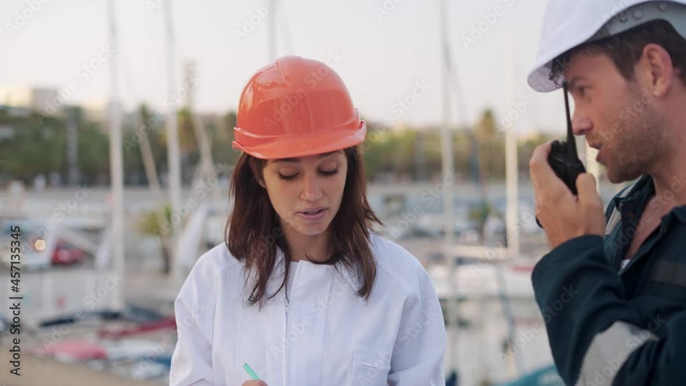 Two marina workers during inspection in yacht club Two marina workers during inspection in yacht club