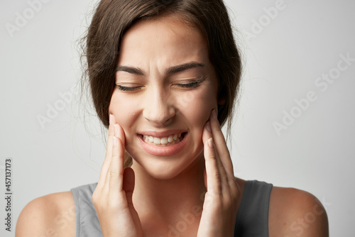 woman in t shirt health problems migraine pain close-up