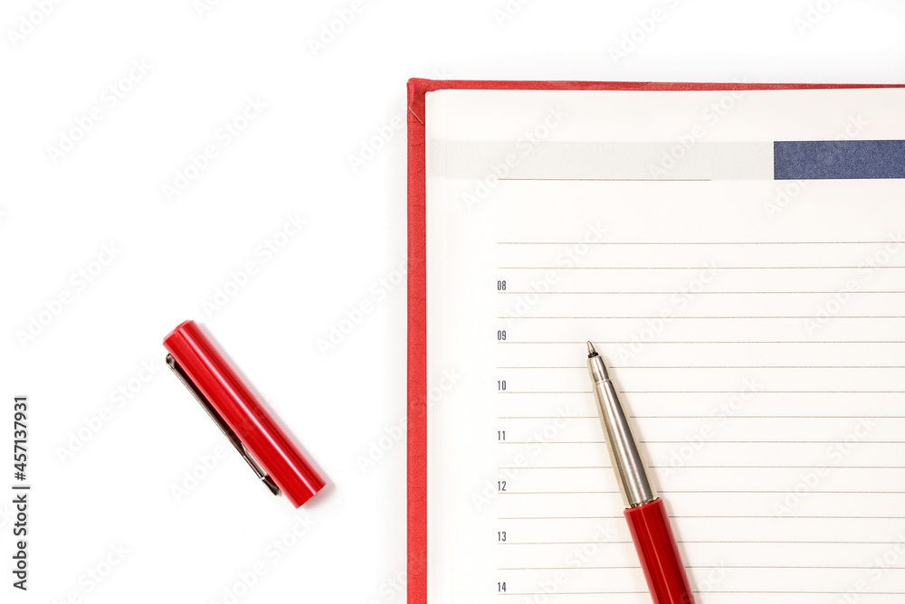 Open clean red notebook with red pen. Notebook, Education, school, college. Gaining knowledge, planning. View from above. Copy space Open clean red notebook with red pen. Notebook, Education, school, college. Gaining knowledge, planning. View from above. Copy space