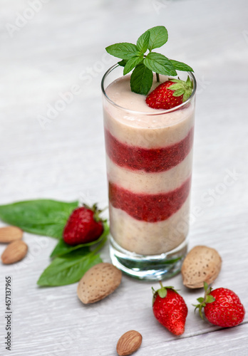 Strawberry banana smoothie with vegetable milk and almonds  selective focus. Healthy  low-calorie and low-carb healthy food. Healthy eating  nutrition and diet concept