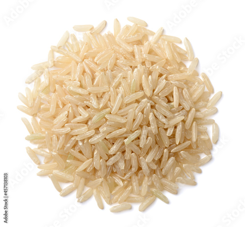 close up of uncooked long brown rice isolated on white, top view