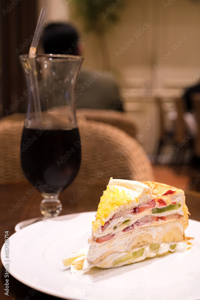 Harbs fruits mille crepe cake with coffee StockFoto Adobe Stock