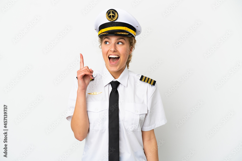 Airplane blonde woman pilot isolated on white background thinking an idea pointing the finger up Airplane blonde woman pilot isolated on white background thinking an idea pointing the finger up