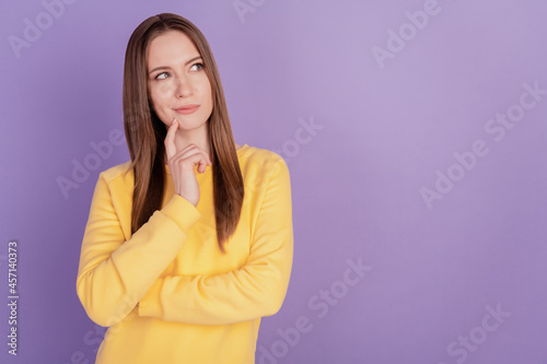 Portrait of pensive ponderous positive lady finger chin look empty space create idea on purple background