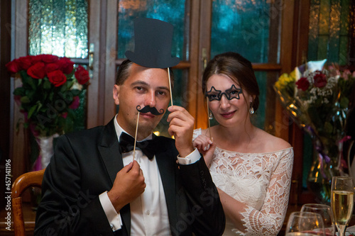 Wedding in moscow. 40 years old. The bride and groom sit in black masks