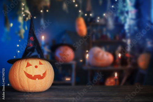 Halloween pumpkins on old wooden table on background Halloween decorations
