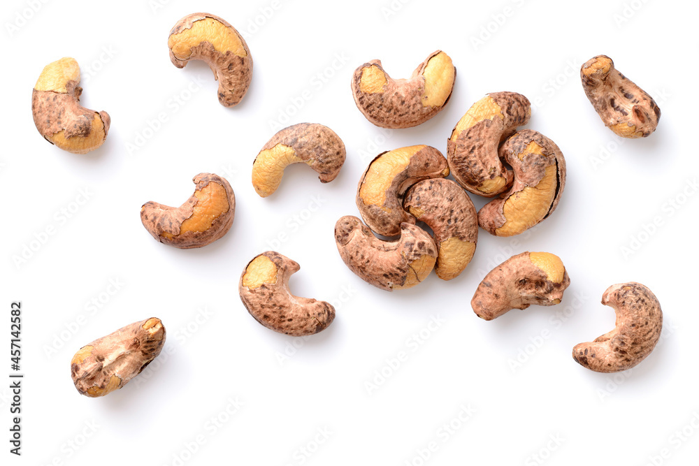 roasted cashew nuts with peel isolated on the white background, top view roasted cashew nuts with peel isolated on the white background, top view