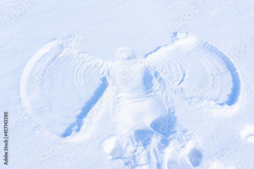 Snow angel's print made in a white snow