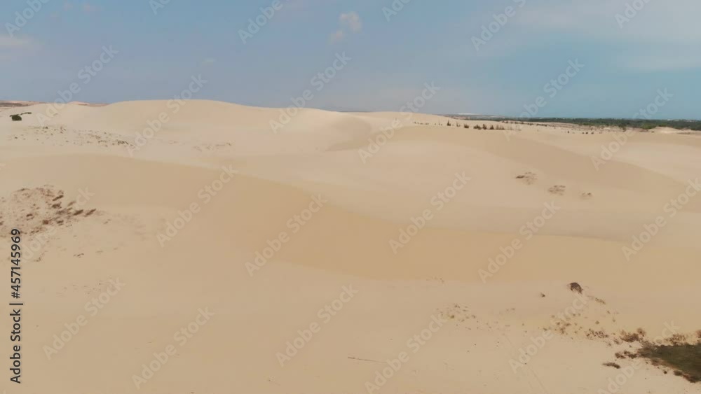 Aerial view flying of brown winding sand dunes in desert Aerial view flying of brown winding sand dunes in desert
