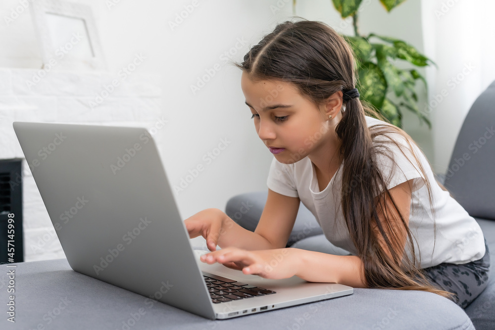 little girl studying with computer, little girl with laptop online. little girl studying with computer, little girl with laptop online.
