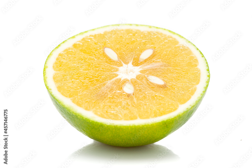 Close-up of Organic Indian Citrus fruit sweet limetta or mosambi (Citrus limetta) with its half cut, it is an green and yellow in color, isolated over white background, Close-up of Organic Indian Citrus fruit sweet limetta or mosambi (Citrus limetta) with its half cut, it is an green and yellow in color, isolated over white background,