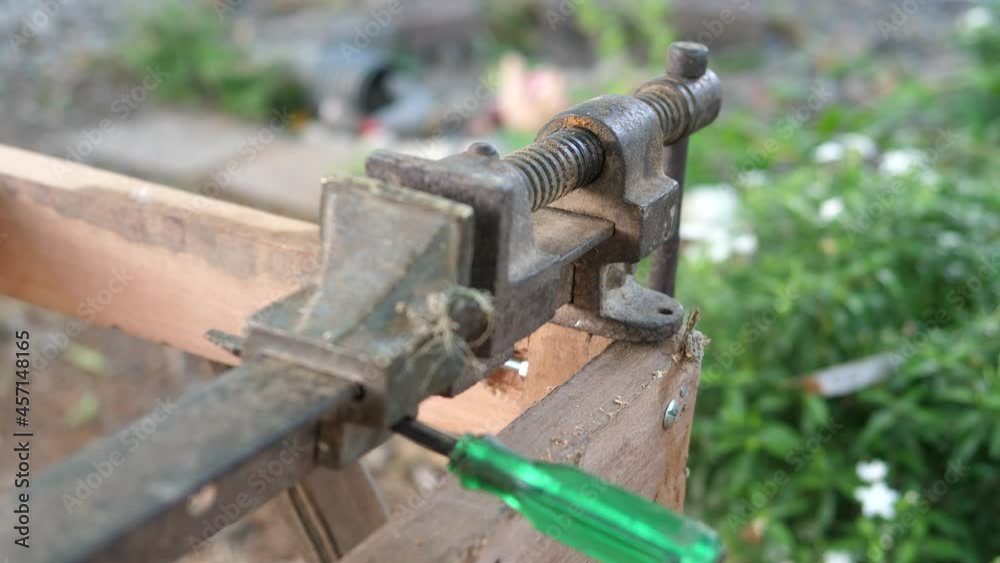 Close up of old metal rusty manual tools, equipment in working place of making timber furniture outdoor in nature background. Concept of wood carpentry, hobby, DIY in free time, vintage retro location Close up of old metal rusty manual tools, equipment in working place of making timber furniture outdoor in nature background. Concept of wood carpentry, hobby, DIY in free time, vintage retro location
