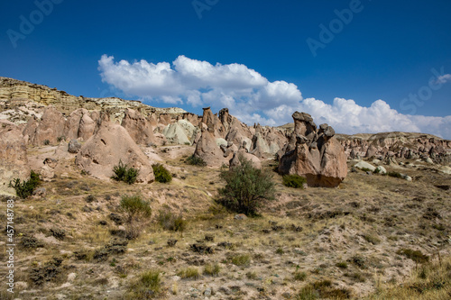 Cappadocia, Turkey - September 1, 2021 – Impressive nature by chimney rock formations and rock pillars of “love Valley” near Goreme, Cappadocia, Nevsehir, Turkey