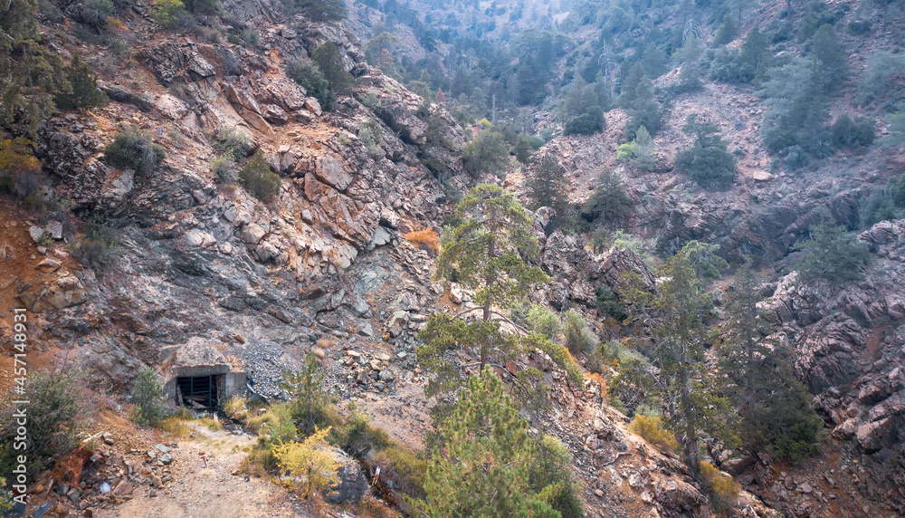 Mountains landscape with an adit of old abandoned mine