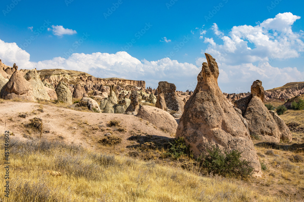 Fototapeta premium Cappadocia, Turkey - September 1, 2021 – Impressive nature by chimney rock formations and rock pillars of “love Valley” near Goreme, Cappadocia, Nevsehir, Turkey