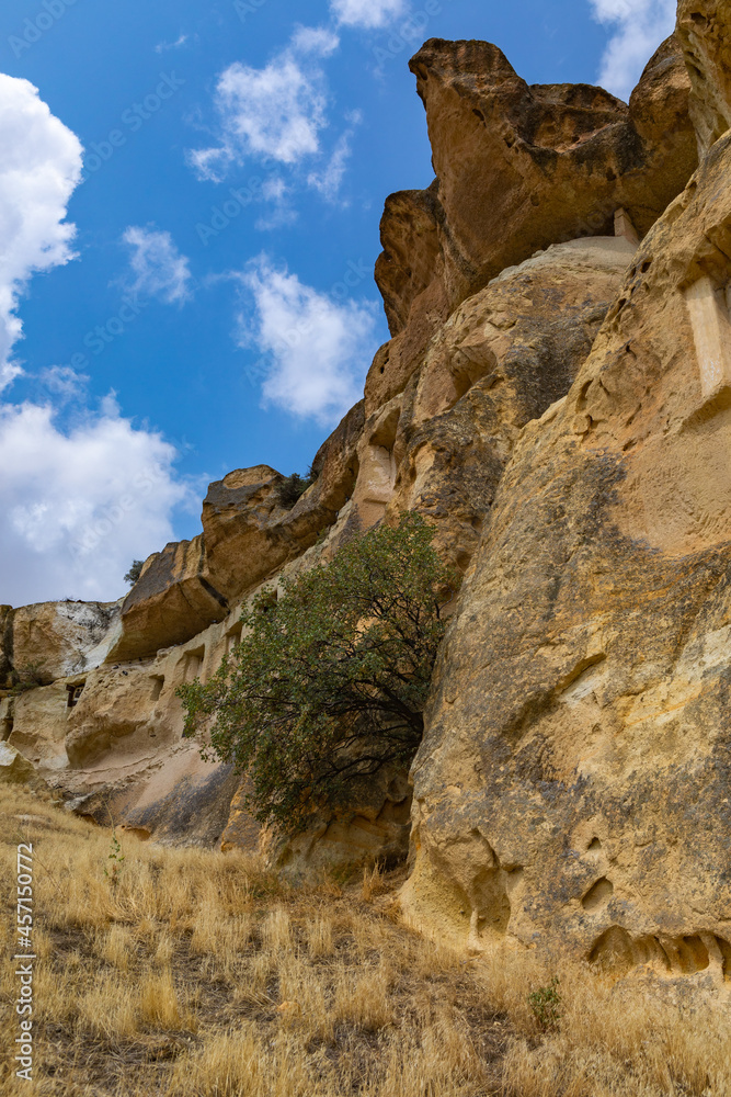 Cappadocia, Turkey - September 1, 2021 – Impressive ancient cave home which had been carved in the Vulcanic rock cliff face of Pigeon Valley at Uchisar in the Cappadocia region of Turkey.