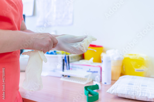 doc ready with gloves in the laboratory hospital virology examination to prepare analysis blood probe covid test results