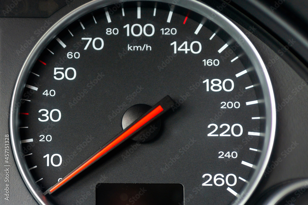 Speedometer in a car. Car dashboard. Dashboard details with indication lamps.Car instrument panel. Dashboard with speedometer.Car detailing. Modern interior.Closeup.Copy space.