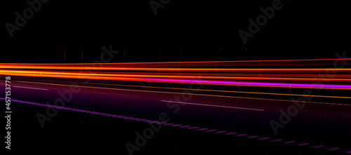 Night road lights. Lights of moving cars at night. long exposure red, blue, orange, multicolored