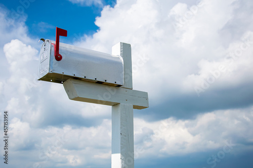 US mailbox in the countryside with sky background
