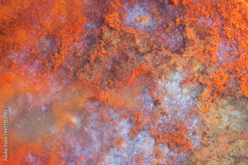 Full-screen stone texture. Close-up view of natural red jasper with blue chalcedony.