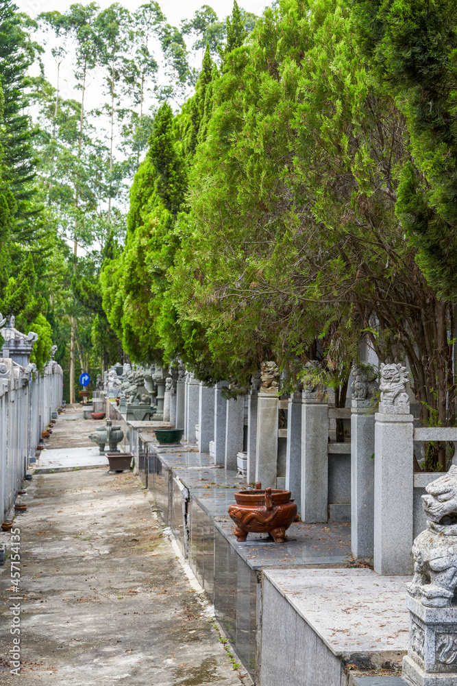 Rows of stone tombstones in a public cemetery