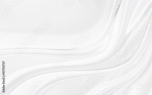 White gray satin texture that is white silver fabric silk background with beautiful soft blur pattern natural.