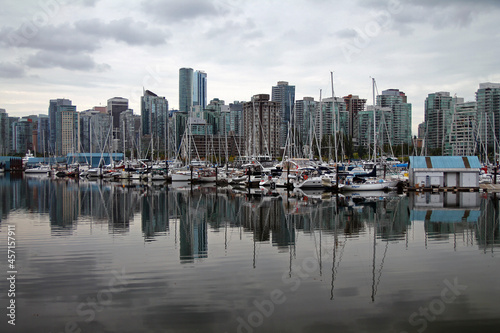 Dramatic reflections of the boats and skyscrapers of Vancouver marina © willeye