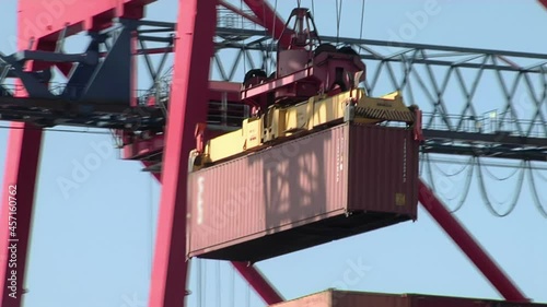 Dockside Gantry Crane and Container in a Container Terminal in Dock Sud, Port of Buenos Aires, Argentina.  photo
