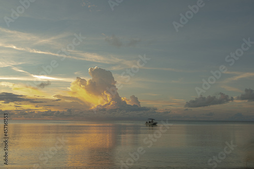 sunset with boat on ocean © satoru