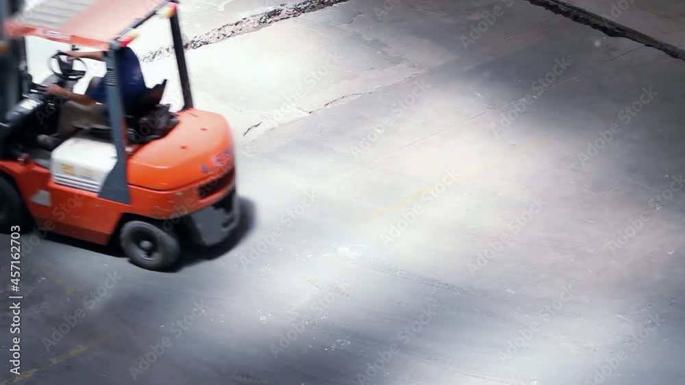 Forklift Truck at Warehouse. High Angle View. 4K Resolution. Forklift Truck at Warehouse. High Angle View. 4K Resolution.