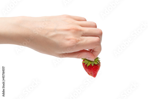 Strawberry kept in hands isolated on white background.