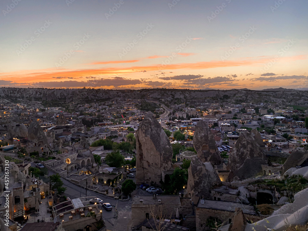 View of the night city of Goreme, Cappadocia, Turkey. Beautiful sunset from the observation deck