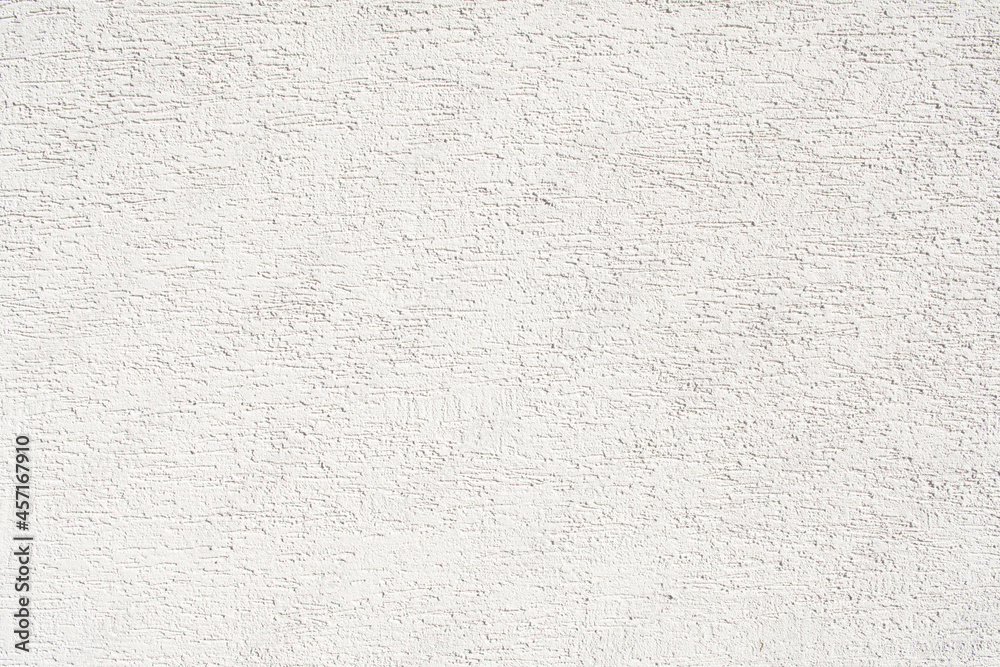Fototapeta premium White rough plaster on wall