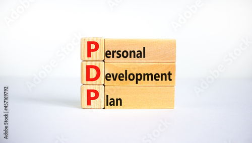 PDP, Personal development plan symbol. Words PDP, Personal development plan symbol on blocks on a beautiful white background. Business, PDP, Personal development plan symbol concept. Copy space. photo
