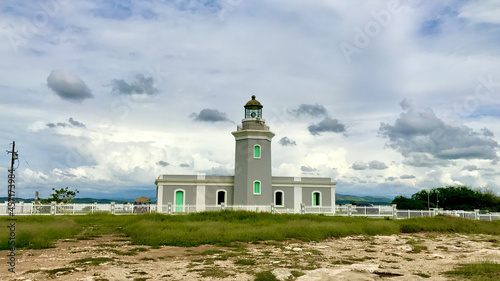 Morrillos Light surrounded by a field under a cloudy sky in Puerto Rico photo