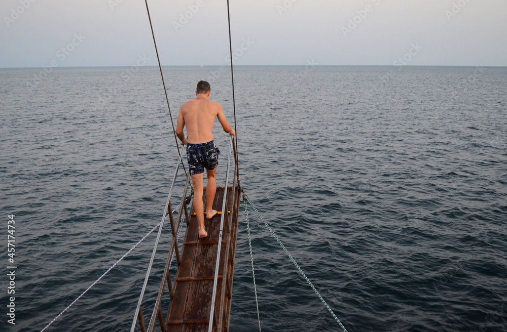 Man preparing to jump from the ship