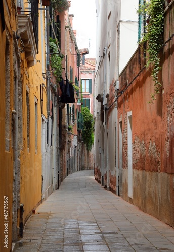 narrow street of the city of Venice called calle where cars cannot pass without people