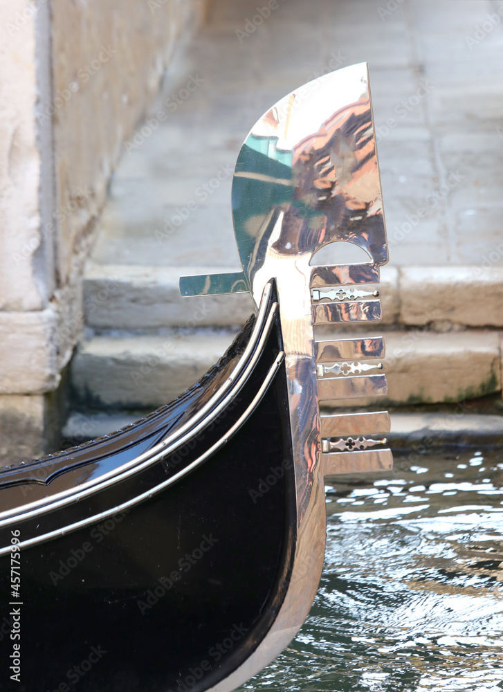 prow of the boat called gondola which symbolizes the seven districts of Venice called sestieri