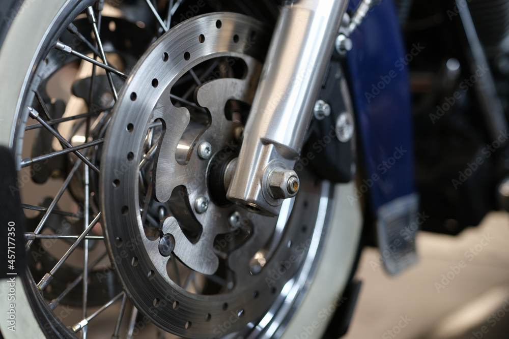 Closeup of brake disc on motorcycle wheel